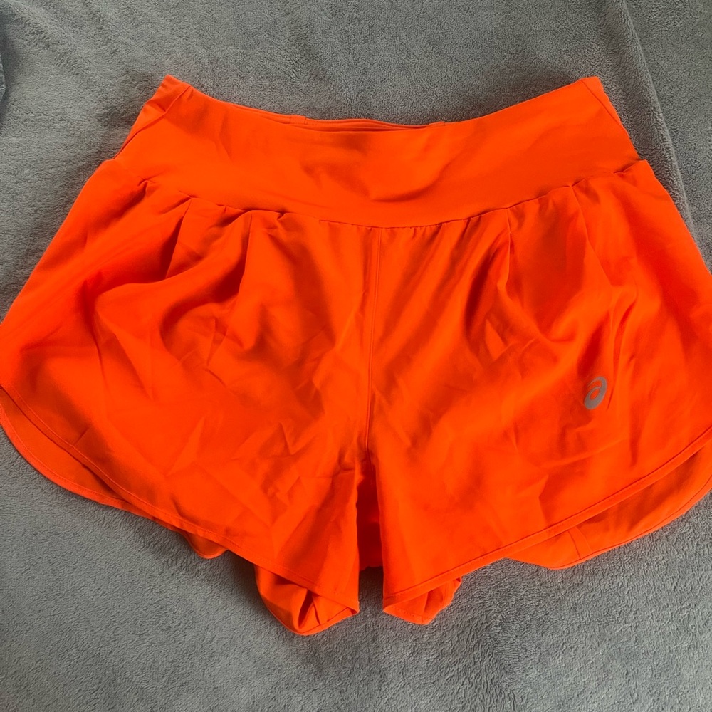 Orange ASICS running shorts